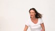 Cute woman painting towards the camera