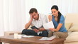Worried couple calculating their domestic bills
