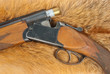 Shotgun with shell on fur Shotgun with shell on fur