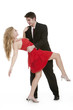 Attractive teenage couple dancing and looking at eachother on is