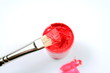 Brush with red paint