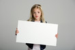 Cute little girl holding a blank sign