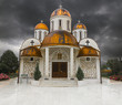 Orthodox church with copper roof and thunder storm