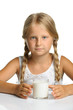 The pretty girl with a glass of milk