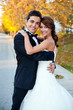happy bride and groom at a park on their wedding day happy bride and groom at a park on their wedding day