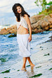 Sexy girl is walking at a beach Sexy girl is walking at a beach