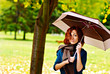Woman is holding umbrella in the autumn forest Woman is holding umbrella in the autumn forest