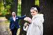 Foto: Joyful bride and groom throw the yellow leaves Joyful bride and groom throw the yellow leaves