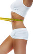 Woman measuring perfect shape of beautiful waist Woman measuring perfect shape of beautiful waist