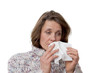 woman holding a tissue having a cold woman holding a tissue having a cold