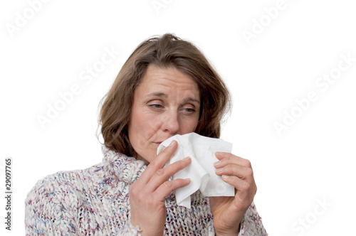 Photo: woman holding a tissue having a cold woman holding a tissue having a cold