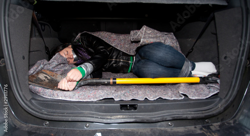 Photo: kidnapped for ransom - tied woman in boot of car kidnapped for ransom - tied woman in boot of car