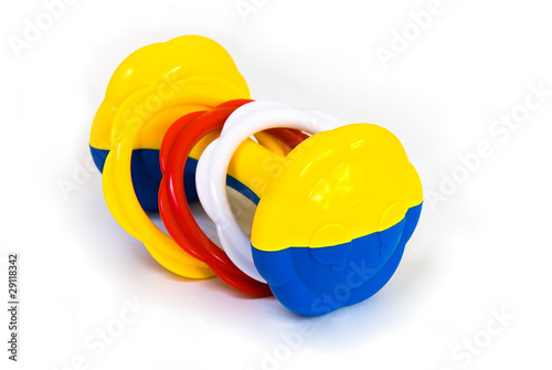 Foto: A colorful baby rattle toy isolated on white A colorful baby rattle toy isolated on white