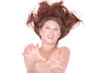Aggressive naked girl lying down selective focus on the hand