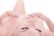 Beautiful naked girl lying down selective focus on the face