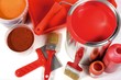 Red painting with pigments, brushes, paint-roller