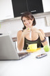 Modern woman reading e-mails at her breakfast