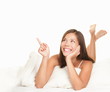 Bed woman pointing up