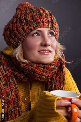 Photo: Beauty, blondie woman with an orange-colored cup Beauty, blondie woman with an orange-colored cup