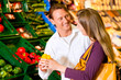 Couple in supermarket shopping groceries