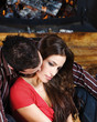 Couple in love near fireplace Couple in love near fireplace