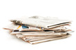Various newspapers over white background