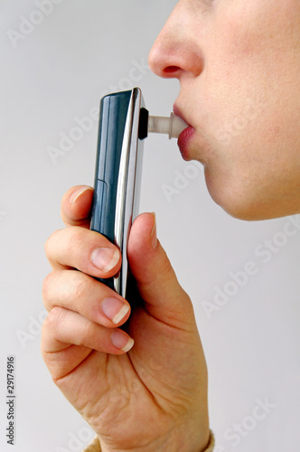 Photo: Alcoholometer - Women perform a test of alcohol Alcoholometer - Women perform a test of alcohol