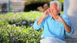 Senior Gentleman Talking on a Cell Phone Outdoors
