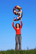 Girl keeps hands over head of inflatable figure of nine Girl keeps hands over head of inflatable figure of nine