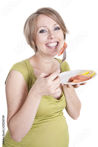 Photo: pregnant woman eats smoked salmon pregnant woman eats smoked salmon