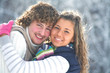 Portrait of smiling couple in winter park