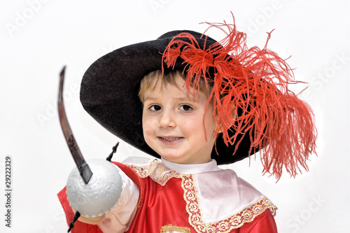 Foto: Boy with carnival costume . Little fighting musketeer. Boy with carnival costume . Little fighting musketeer.