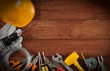 Construction equipments on wood background with copy space. Construction equipments on wood background with copy space.