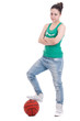 Beautiful young basketball woman in studio