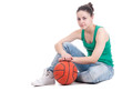 Beautiful young basketball woman in studio