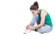Young teenage woman dancing on white