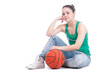 Beautiful young basketball woman in studio
