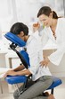 Businesswoman enjoying massage in office