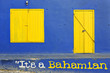 Colorful blue house with yellow doorway and window Colorful blue house with yellow doorway and window