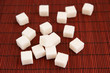 White sugar on wooden background