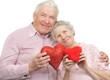 Photo : happy old couple with red hearts