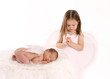 Sister praying over newborn angel