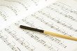 Conductor's baton on sheet music