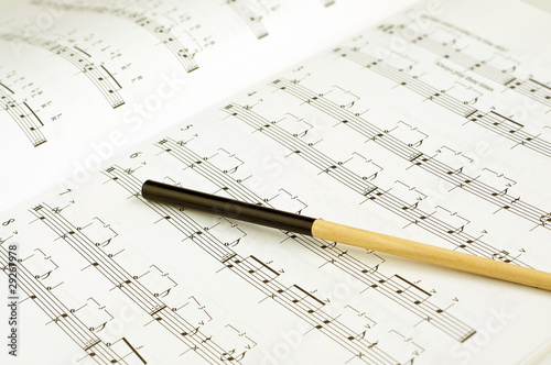 Photo: Conductor's baton on sheet music Conductor's baton on sheet music