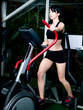 Femme faisant du sport - velo eliptique