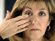 Woman Inserting Contact Lens