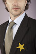 Businessman with gold star on suit, portrait