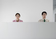 Office workers behind cubicle wall