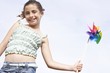 Girl Playing With Pinwheel