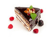 piece of cake with nuts coated with chocolate icing
